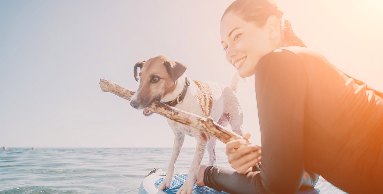 Lady and Dog on Paddle Board 