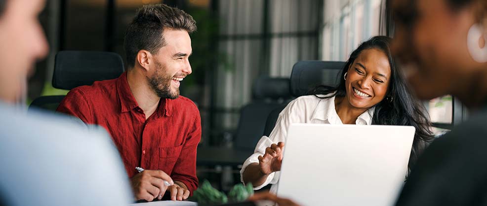 Family Without The Drama - Two employees laughing together