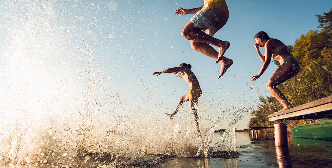 Kids jumping off dock