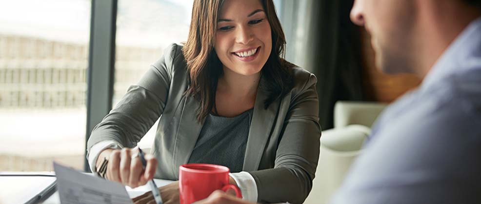Old Enough To Know Better. Local Enough To Do Better. Bank lender meets with customer. 